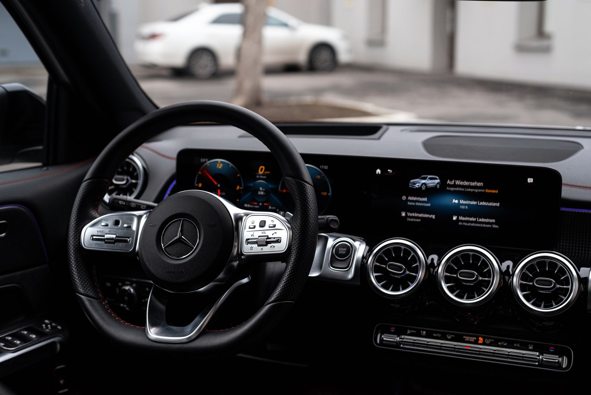 Premium SUV interior dashboard comparison relevant to Range Rover Sport vs Porsche Cayenne